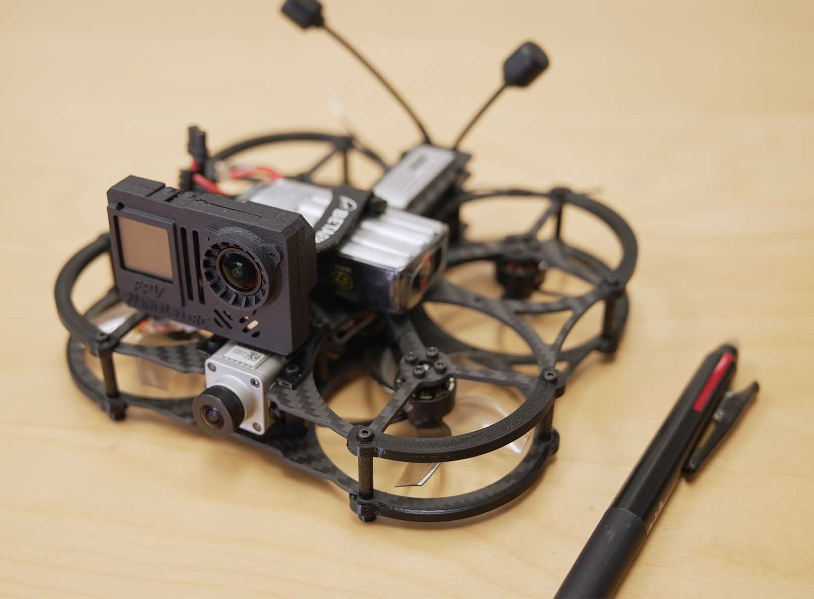 Microdrone pictured with pen.